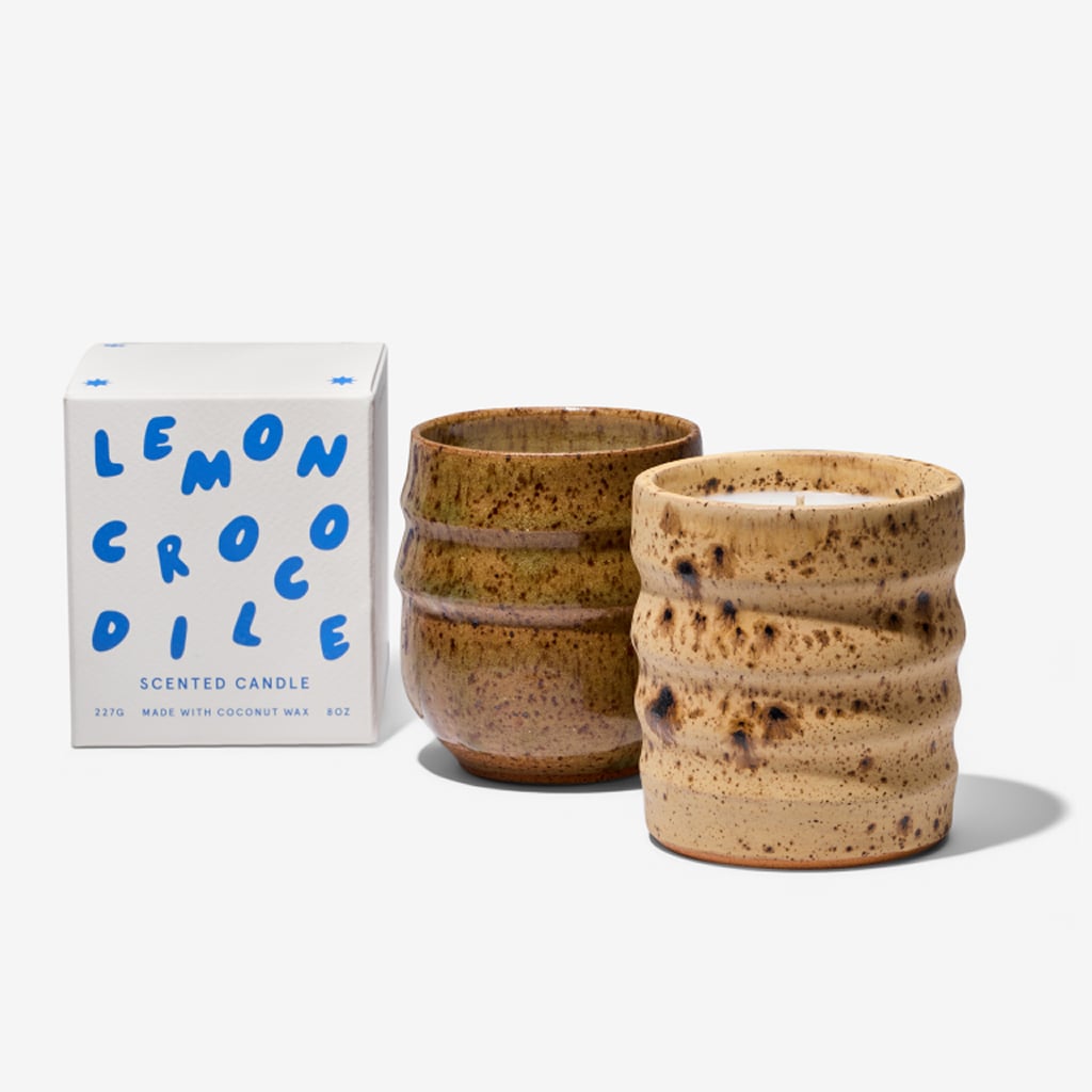 Two handmade ceramic candles beside Lemon Crocodile branded box